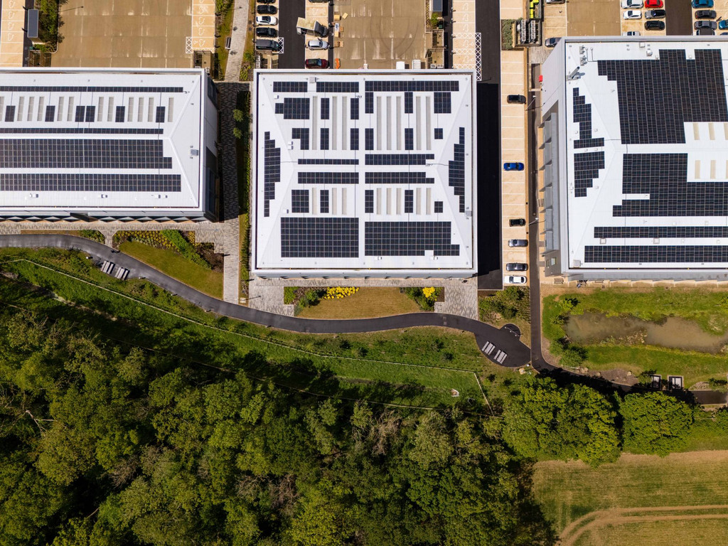 Overhead view of commercial rooftops with solar panels at Bourn Quarter, Cambridge