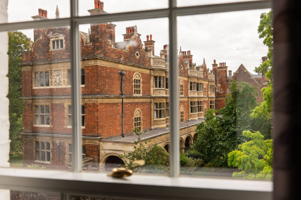 Historic college student accommodation in Cambridge, seen through a sash window