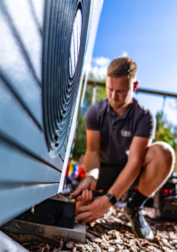 Infinite Heating engineer commissioning an air source heat pump