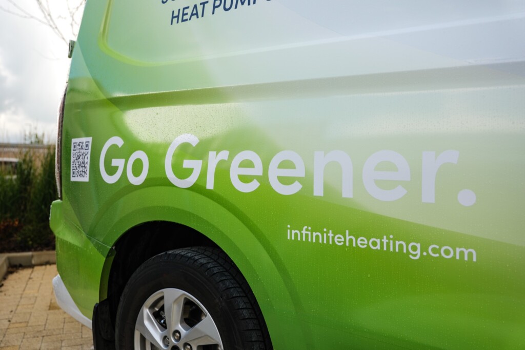 Infinite Heating & Energy branded van with the Go Greener slogan
