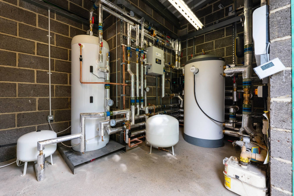 Hot water cylinders and heat pump plant in the nursery plant room